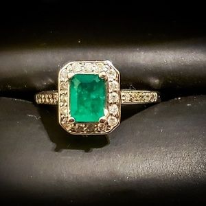 Emerald and diamond white gold ring